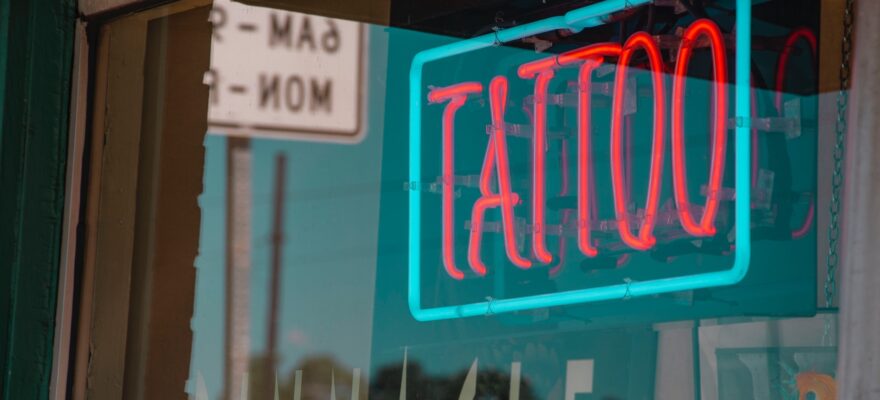 lighted red and green tattoo neon signage