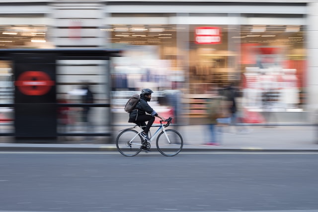 person riding on white road bicycle