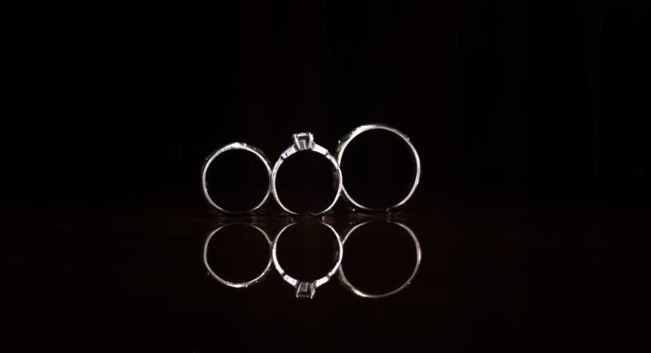 three silver-colored rings