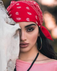 woman in red and white floral hijab