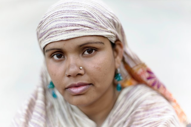 woman in white and purple striped headscarf