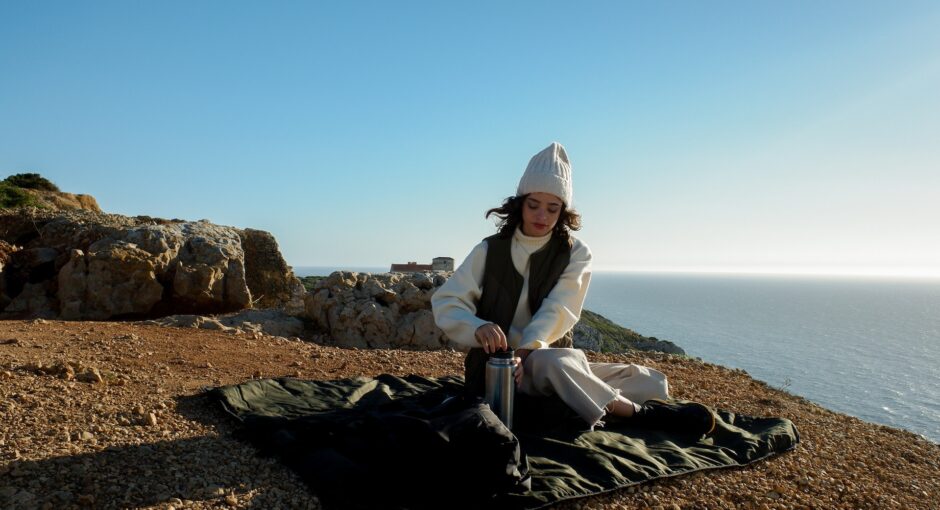 woman sitting on sand